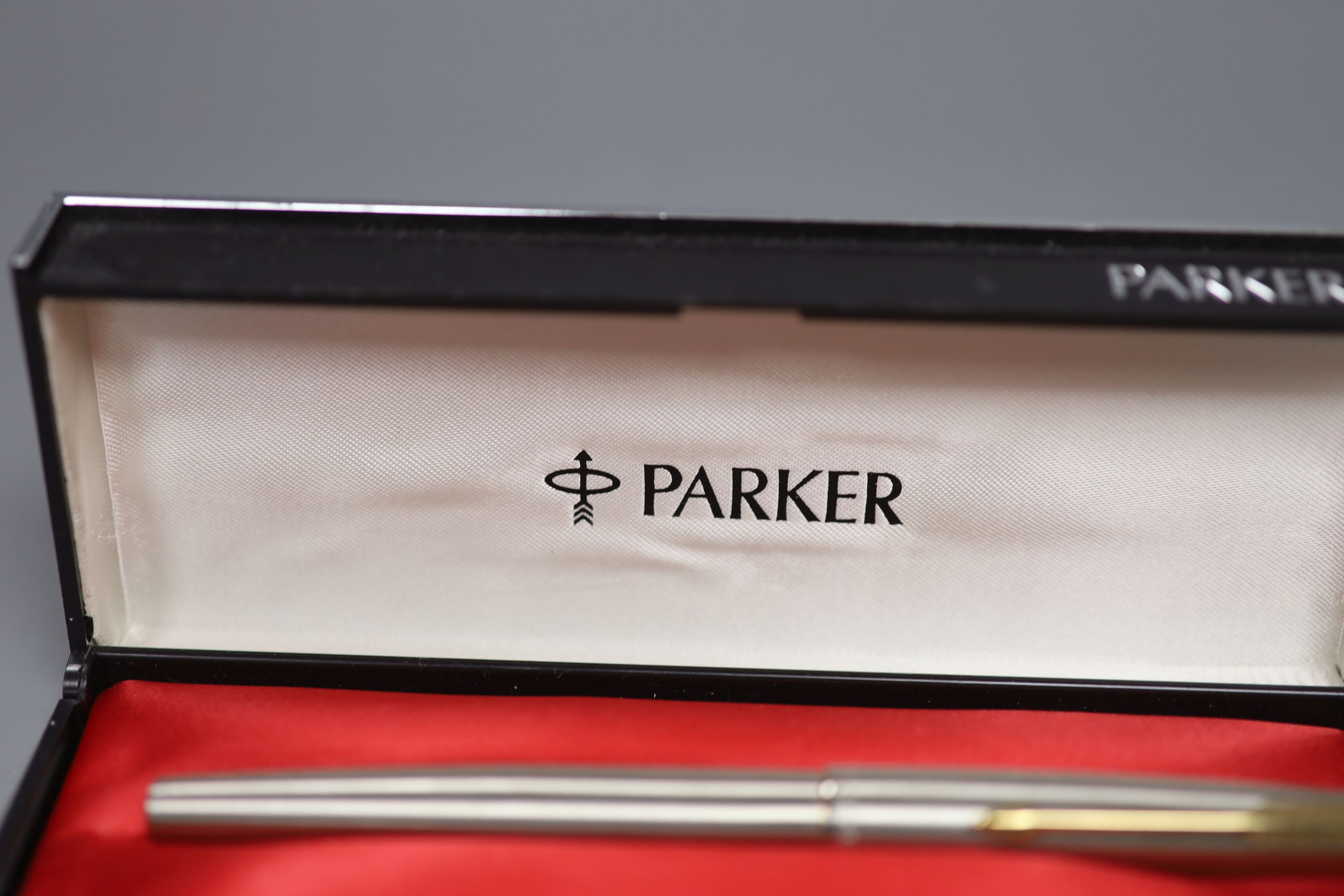 A collection of fountain pens and pencils including a brushed steel Parker 61,